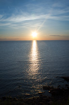 sunburst reflecting over ocean water 