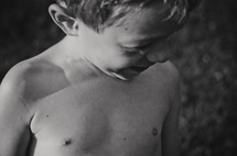 a shirtless boy