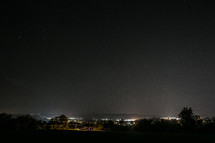 city lights from a hilltop at night
