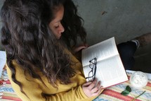 young woman reading a book 
