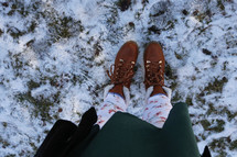 boots standing in snow 