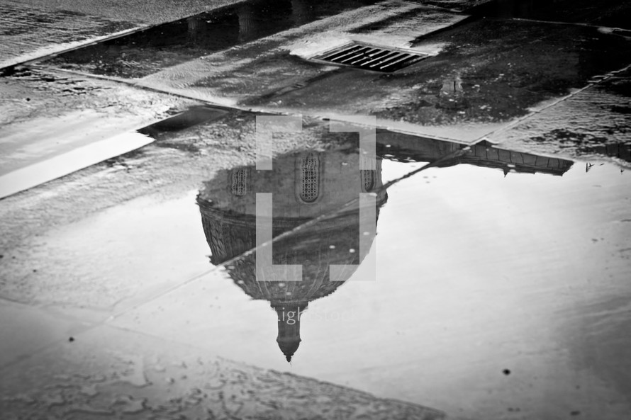reflection of a dome in a puddle