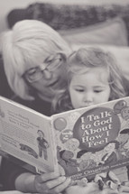 Grandma reading to her granddaughter 