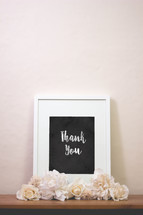 chalk words thank you in a frame with flowers 