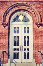 church doors with stained glass windows 