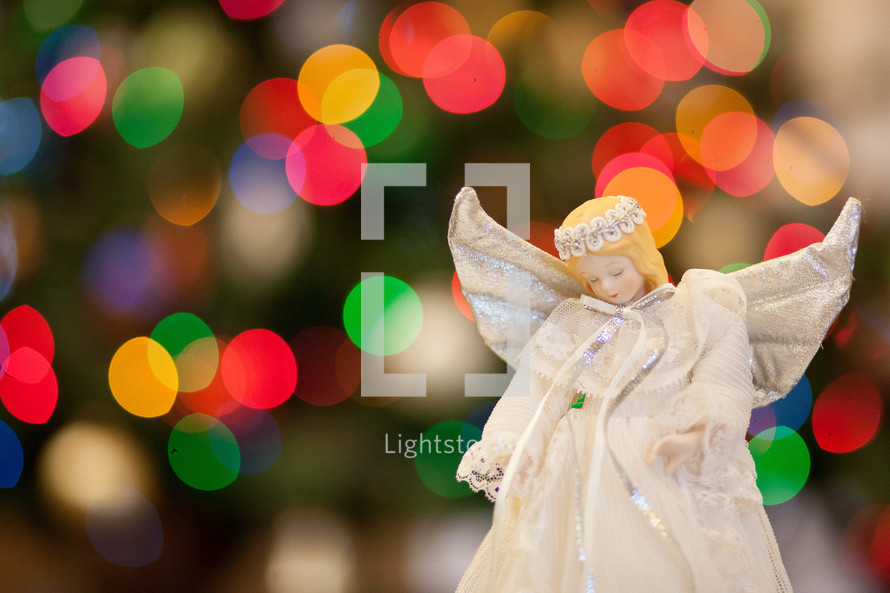 angel ornament and bokeh Christmas lights 