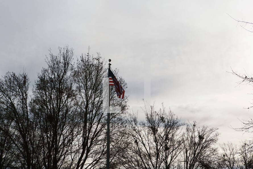 An American flag on a flag pole. 