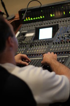 Man operating a production board.