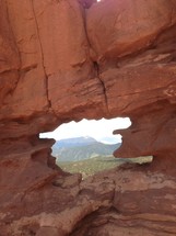 hole in a red rock formation
