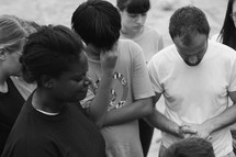 a group of missionaries in prayer