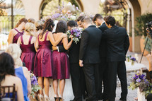 wedding party gathered in prayer