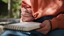 Philosopher Boy Thinks Seated Under The Olive Tree With Pencil And Notebook