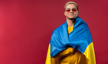 Smiling man with national Ukrainian flag