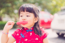girl eating a popsicle 