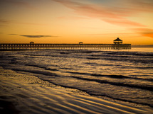 pier and tide at sunset 