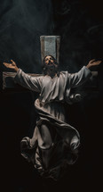 Crucifix on a black background with smoke