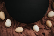 eggs and black circle 