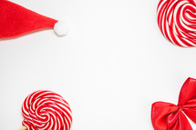 Flatlay of some red Christmas decoration, on a white background. Background for Christmas.