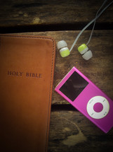 A Holy Bible, iPod, and earbuds 