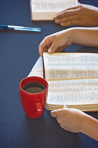 A Table Set for a Bible Study as People Search the Scriptures