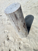 Post in the sand.