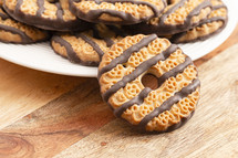 Fudge Striped Shortbreak Cookies on a Wooden Kitchen Table