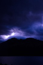 storm clouds over a mountain peak 
