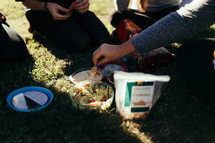 friends enjoying a picnic in the park 