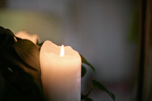 A burning candle. 