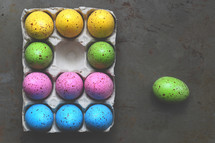 speckled Easter eggs in a carton 