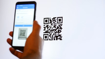 Scan QR code with smartphone on computer monitor