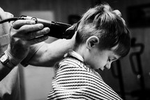 a boy child at the barber shop 