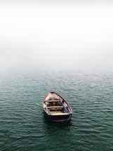 empty boat floating on water 
