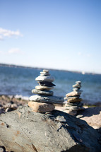 Stacks of rocks near the ocean.