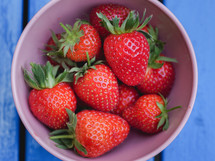 a bowl of fresh, ripe strawberries