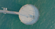 Pier on Venice Beach, panning aerial. Aerial view of the pier near Venice beach in Los Angeles during sunset. 