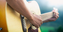 a man playing a guitar 