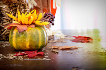 fall decorations on a table top 