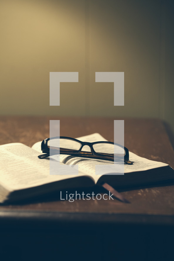 reading glasses on a Bible 