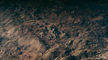 aerial view of jagged mountains below 