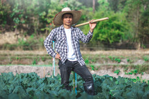 farmer standing in a garden 