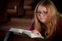 Teen girl reading a Bible 
