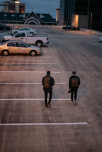 men walking in a parking deck 