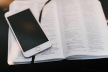 iPhone on the pages of a Bible 
