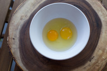 cracked eggs in a bowl 