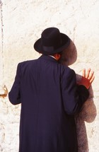 Orthodox Jew kissing the wailing wall 
