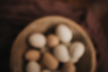 defocused speckled eggs in a bowl 