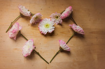 Pink flowers in the shape of a heart.