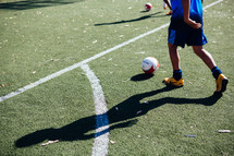 a boy on a soccer field 
