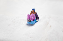 sledding in the snow 